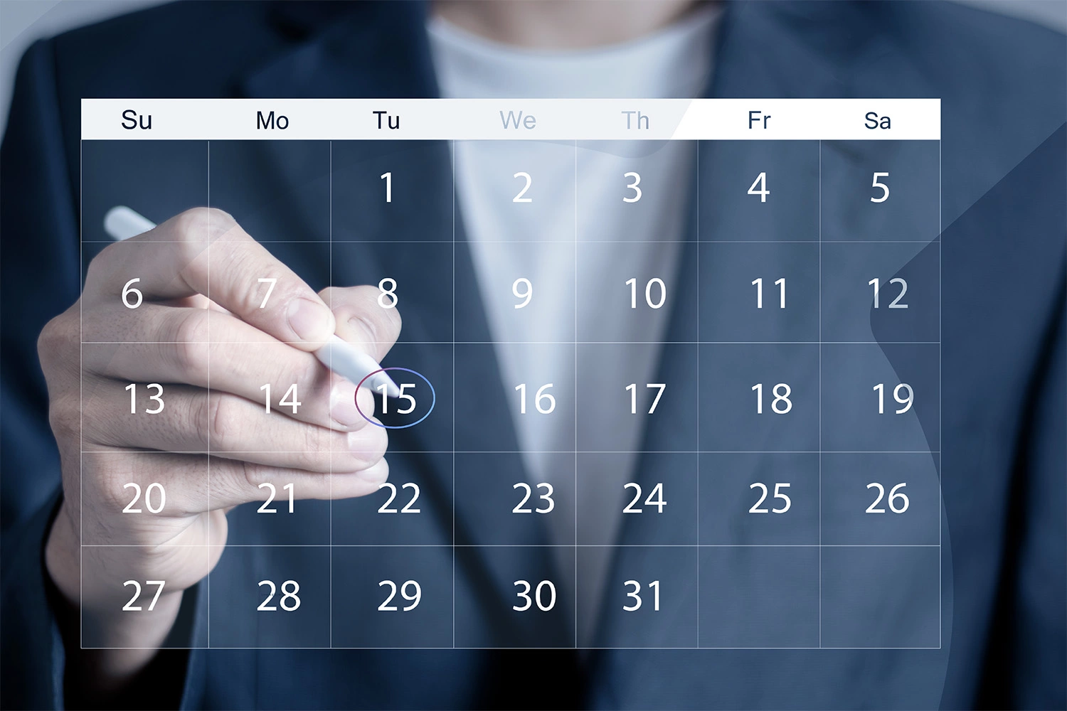 Hand marking a date on a digital calendar – Preview of upcoming events and webinars